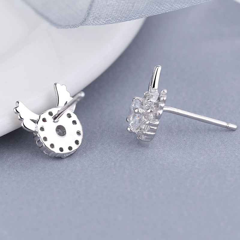 Women's earrings with sparkling crystals and playfully designed wings