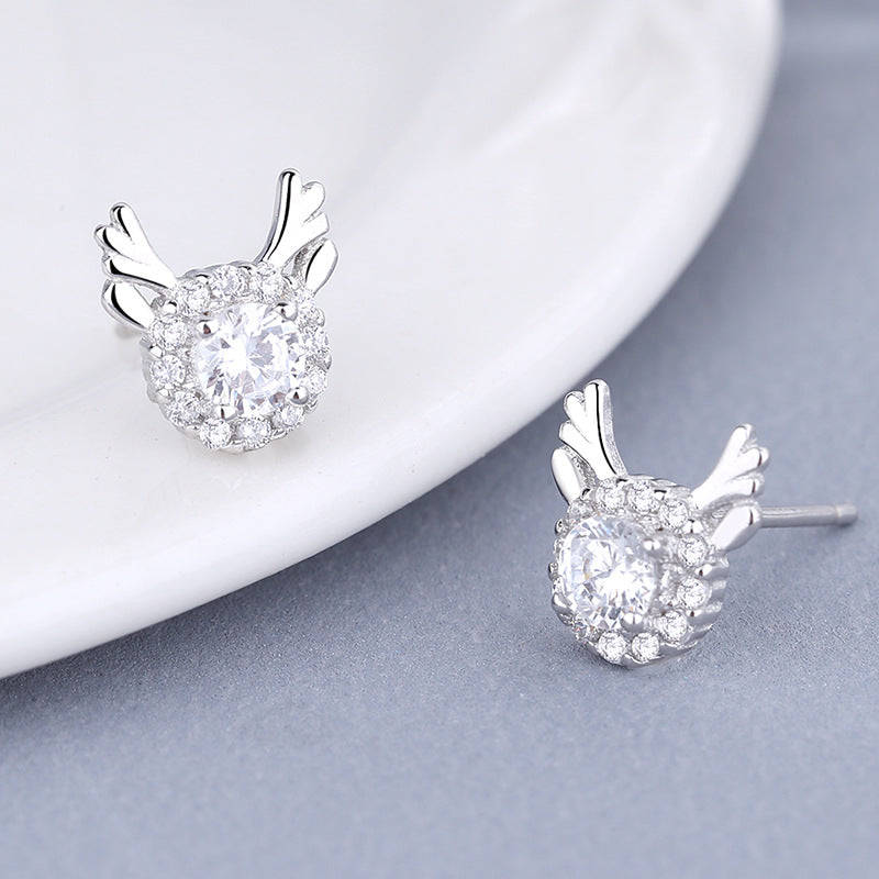 Women's earrings with sparkling crystals and playfully designed wings