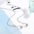 Women's earrings with elegant square pendant and shimmering zirconia
