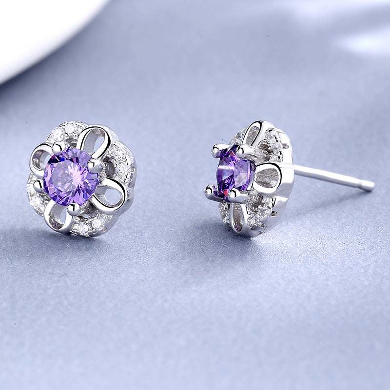 Women's stud earrings with delicate flower design and sparkling crystals