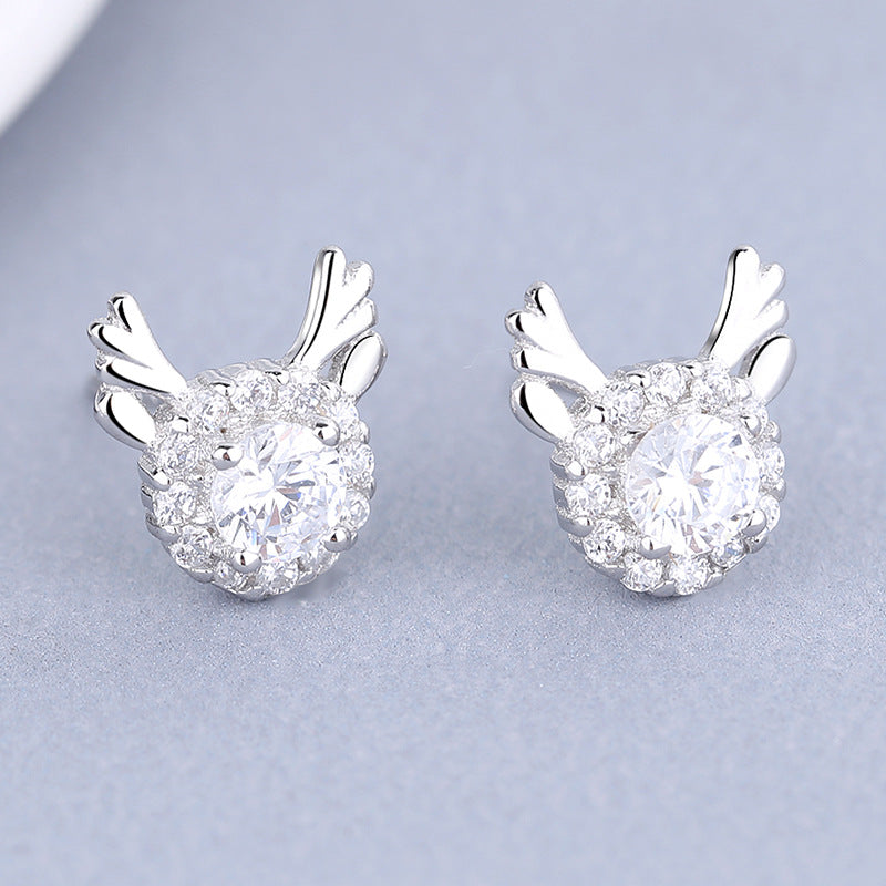 Women's earrings with sparkling crystals and playfully designed wings