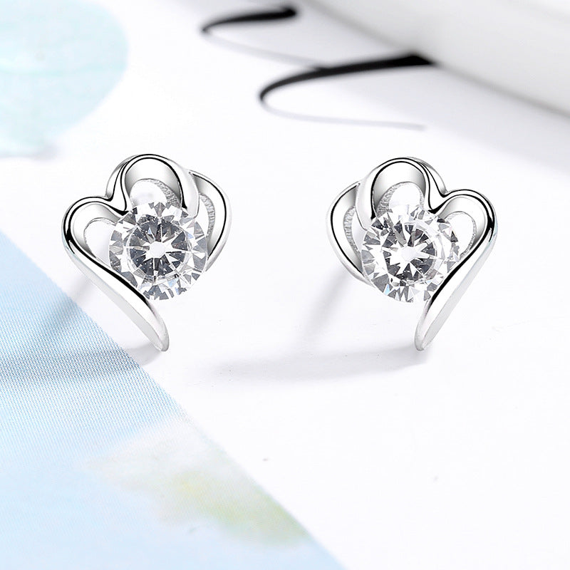 Women’s stud earrings with stylish heart design and sparkling crystals