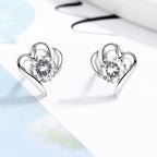 Women’s stud earrings with stylish heart design and sparkling crystals