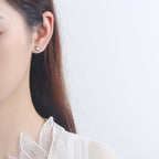 Women’s stud earrings with stylish heart design and sparkling crystals