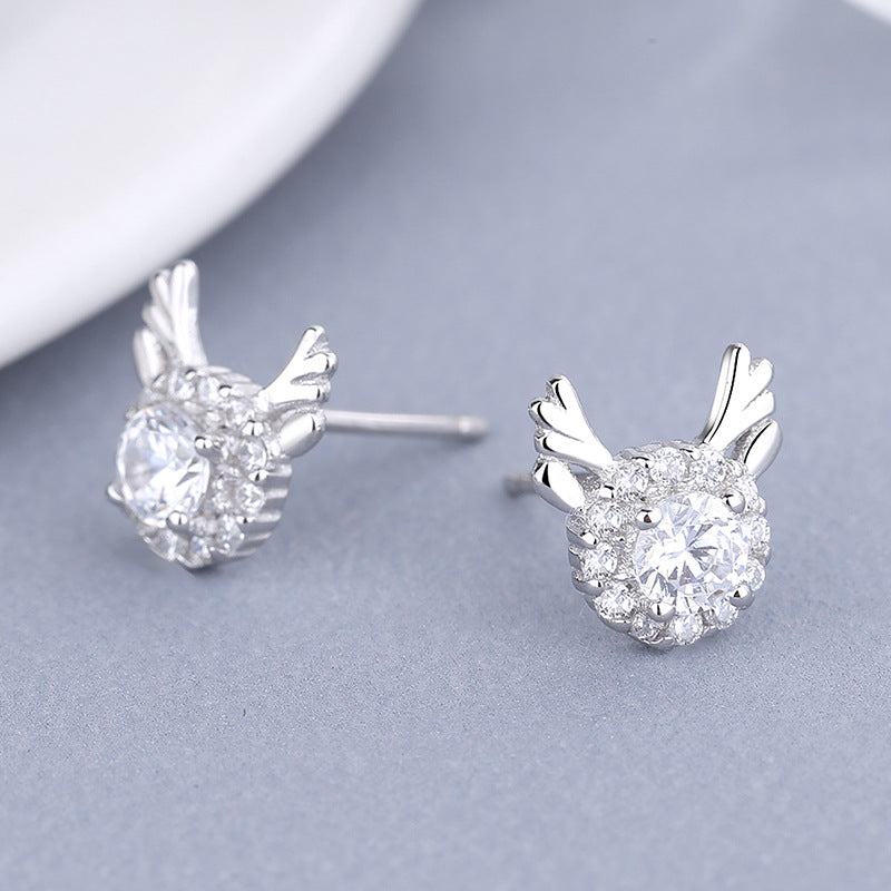 Women's earrings with sparkling crystals and playfully designed wings