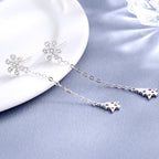 Women’s earrings with sparkling snowflake pendant and chain embellishment