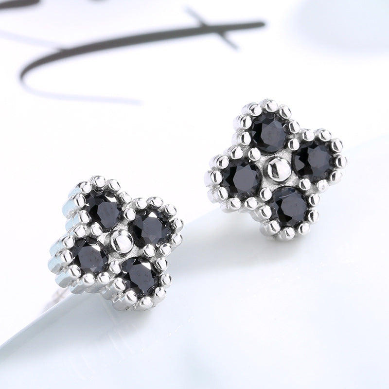 Women's earrings with multilayer floral design and sparkling zirconia