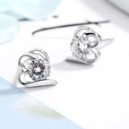 Women’s stud earrings with stylish heart design and sparkling crystals