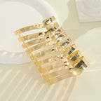 Women's hair accessories with shiny, curved elements