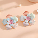 Ladies' flower earrings with intricate design and glossy accents