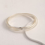 Women's bangle set with elaborate, braided and simple designs