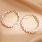 Ladies hoop earrings with luxurious pearl accents and elegant, twisted design