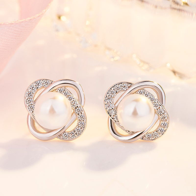 Ladies earrings with artistic pearl design and sparkling zirconia