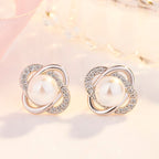 Ladies earrings with artistic pearl design and sparkling zirconia