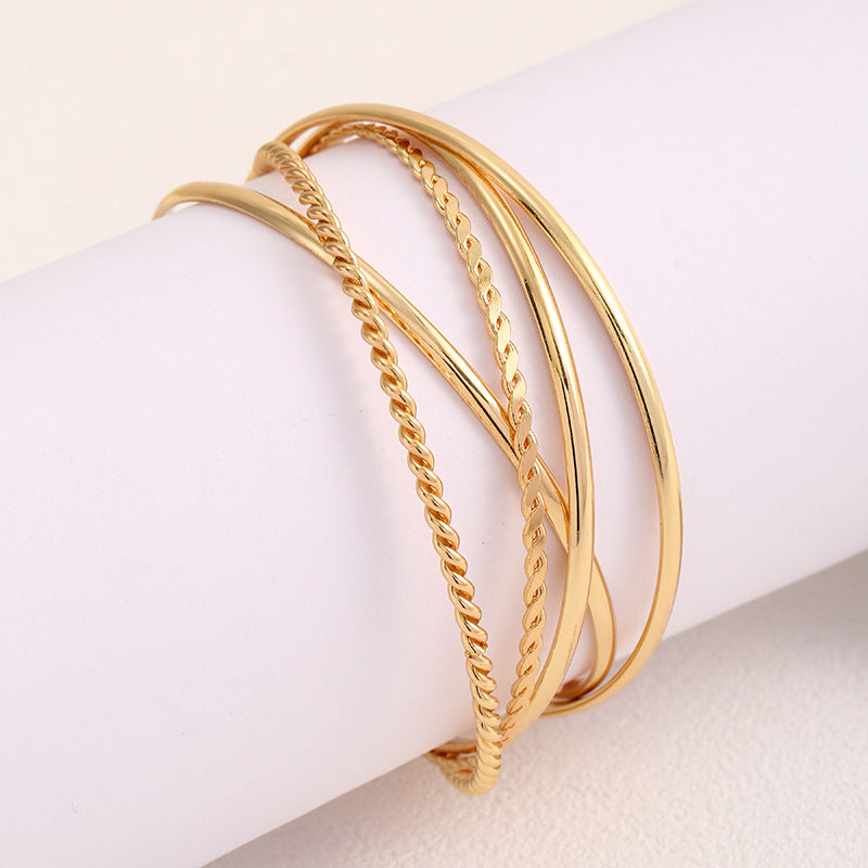 Women's bangle set with elaborate, braided and simple designs