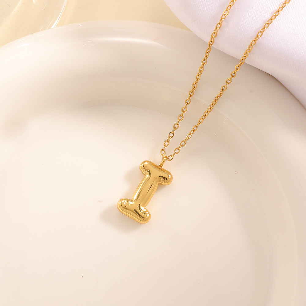 Women's necklace with curved letter pendant