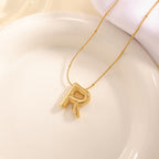 Women's necklace with curved letter pendant