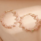 Ladies hoop earrings with luxurious pearl accents and elegant, twisted design