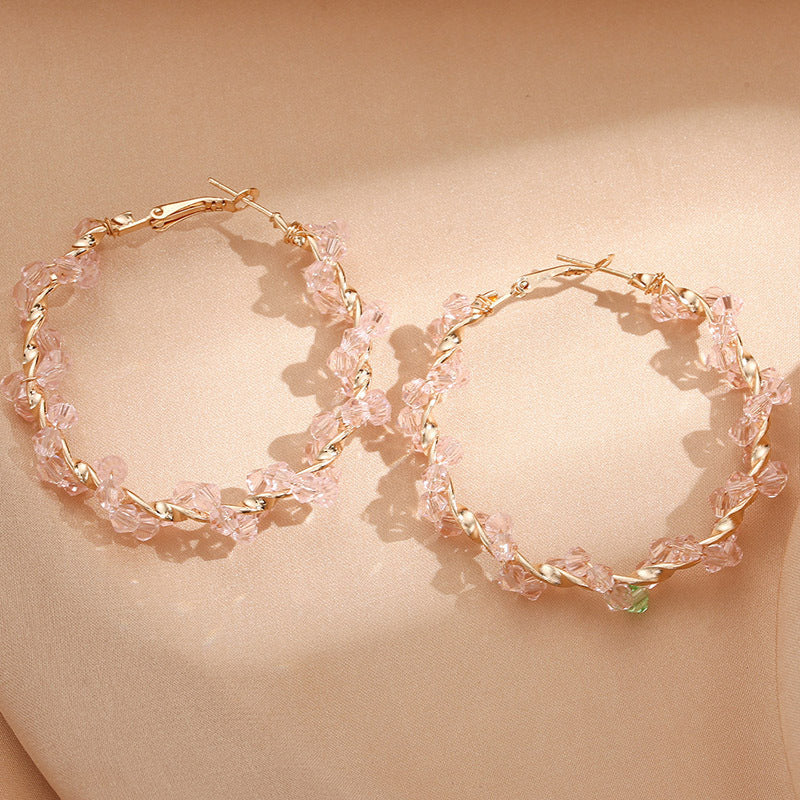 Ladies hoop earrings with luxurious pearl accents and elegant, twisted design