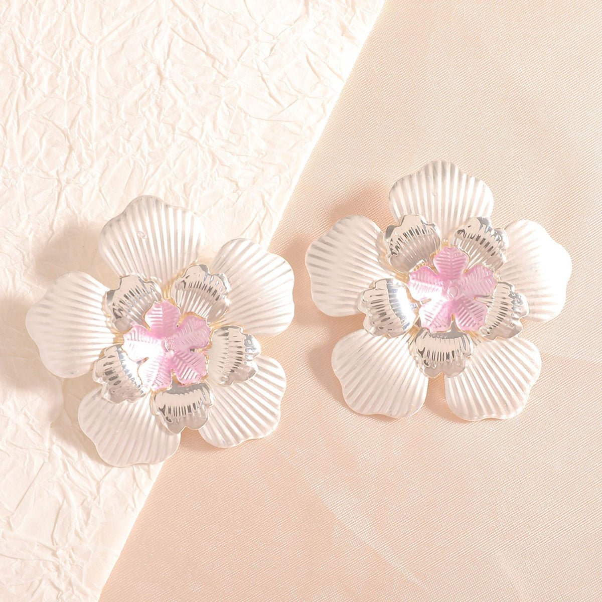 Ladies' flower earrings with intricate design and glossy accents