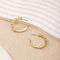 Ladies hoop earrings with intricate structures