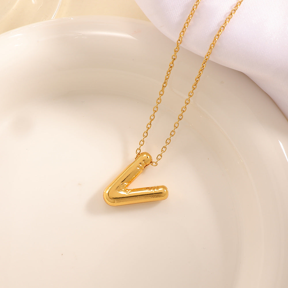 Women's necklace with curved letter pendant
