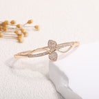 Women's bangle with elegant infinity pattern and sparkling zirconia