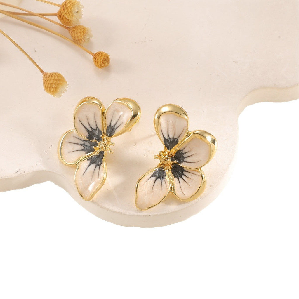 Women's ear clips in elegant floral design with a glossy coating