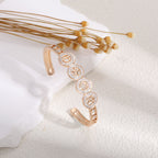 Ladies bracelet with elaborate infinity symbol and sparkling zirconia