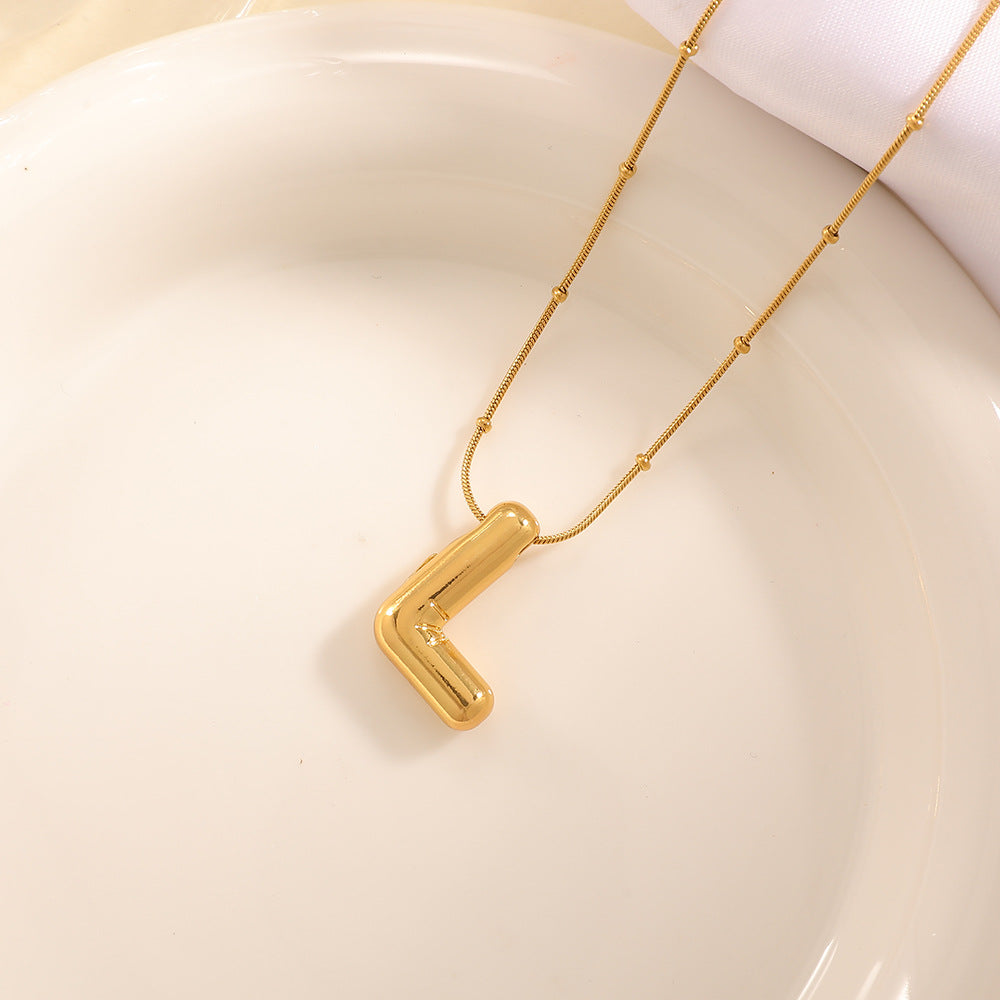 Women's necklace with curved letter pendant