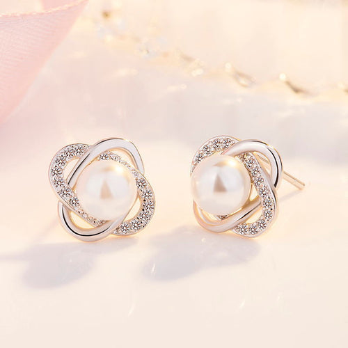 Ladies earrings with artistic pearl design and sparkling zirconia
