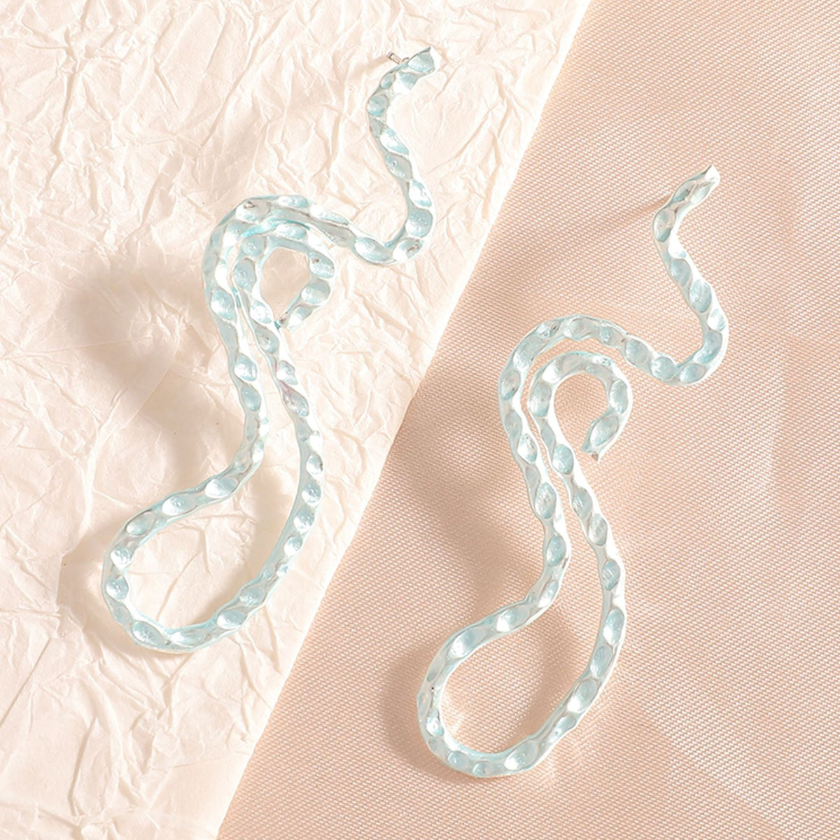 Ladies earrings in elegant wave pattern