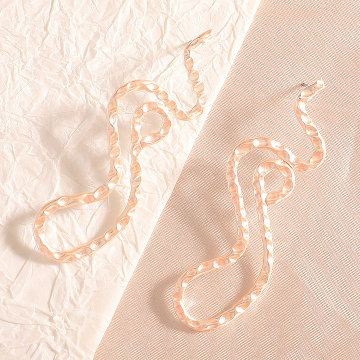 Ladies earrings in elegant wave pattern