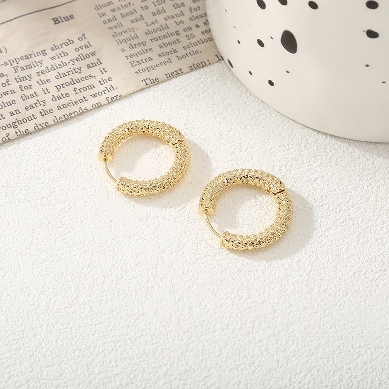 Women's hoop earrings with modern, textured design