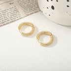 Women's hoop earrings with modern, textured design