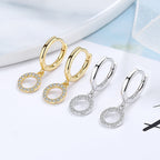 Women's earrings with sparkling circle pendant