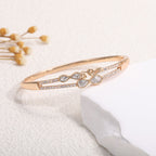 Women's bangle with elegant infinity pattern and sparkling zirconia