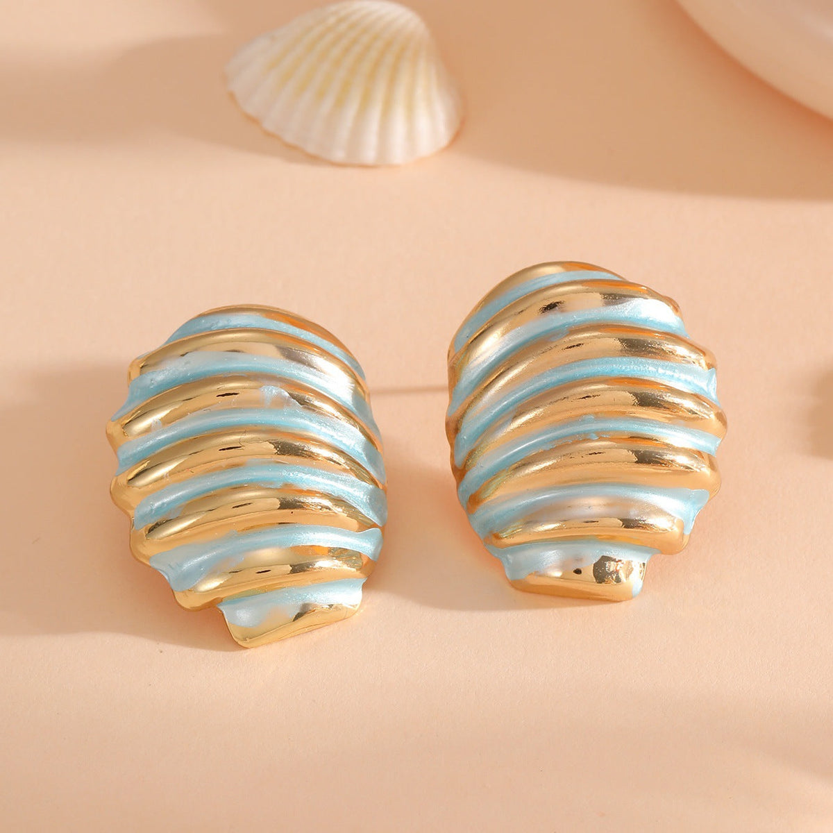 Women's ear clips in maritime shell design
