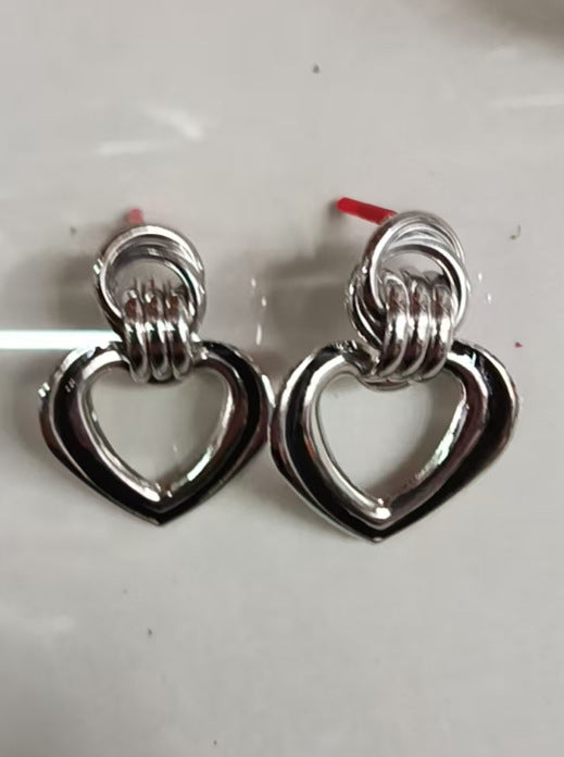 Women’s earrings in modern heart design