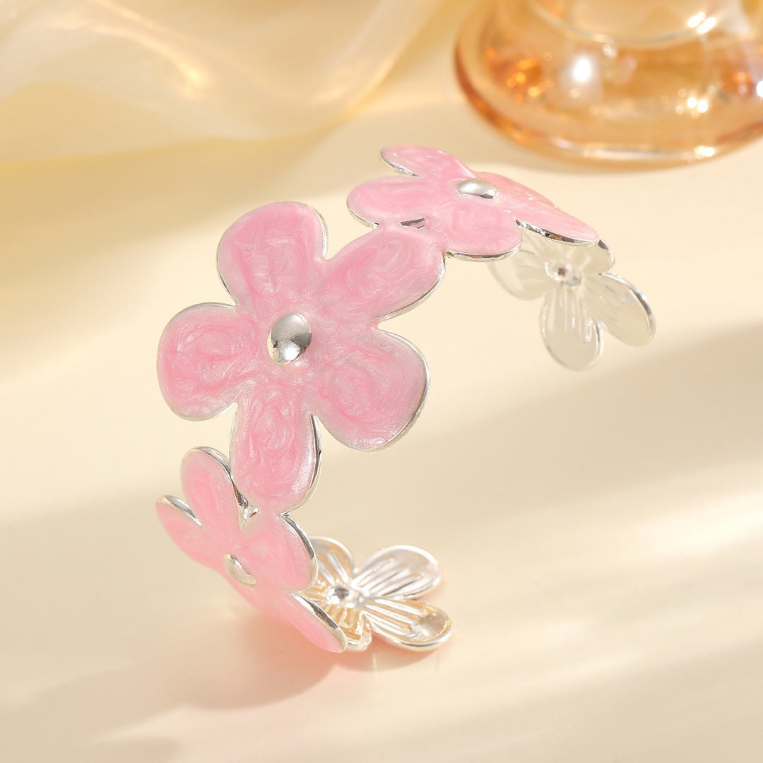 Women's bracelet made of high-quality metal with floral design