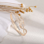 Women's bangle with elegant infinity pattern and sparkling zirconia