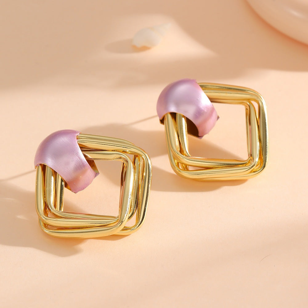 Women modern earrings with asymmetrical design