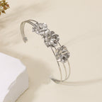 Women's cuff bracelet with artistic leaf motif