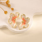 Women's ear clips in elegant floral design with a glossy coating