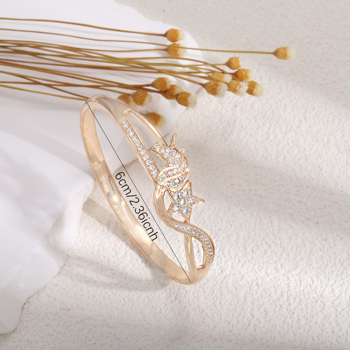 Ladies bracelet with elaborate infinity symbol and sparkling zirconia