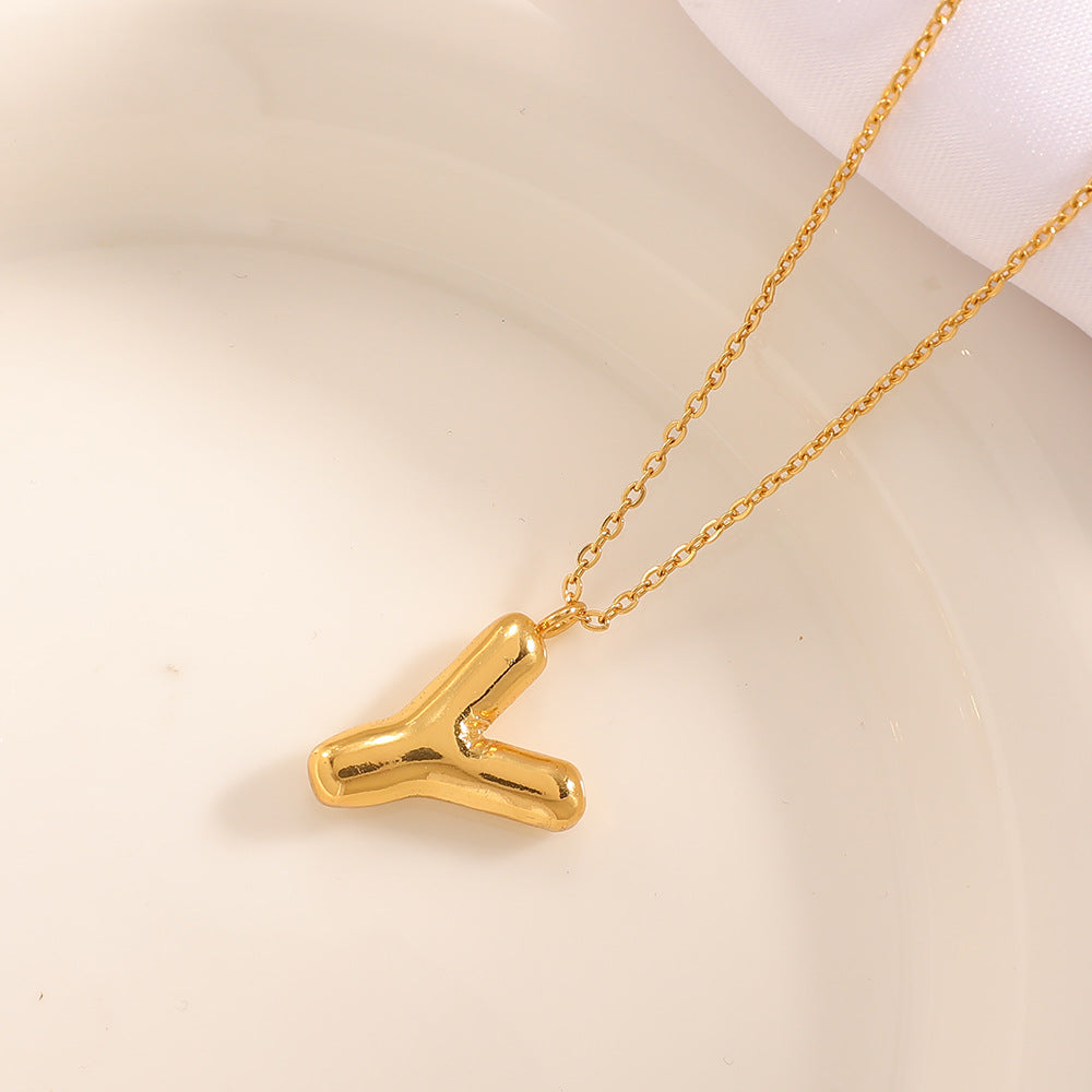 Women's necklace with curved letter pendant