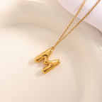 Women's necklace with curved letter pendant