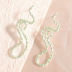 Ladies earrings in elegant wave pattern