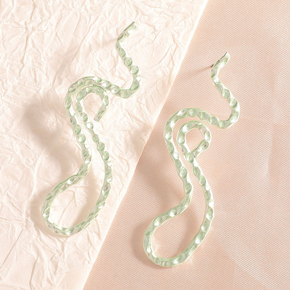 Ladies earrings in elegant wave pattern