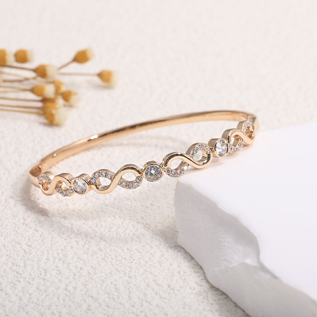 Women's bangle with elegant infinity pattern and sparkling zirconia